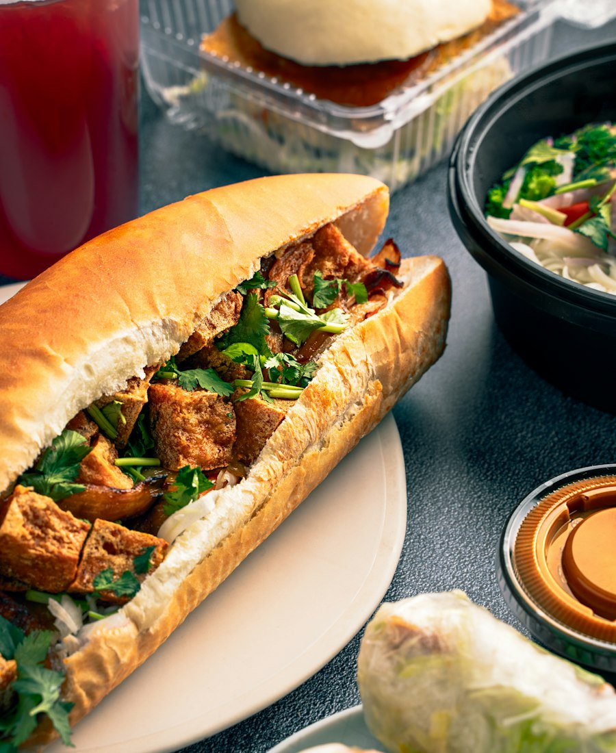 Bánh mì roll filled with meat, herbs and pickles
